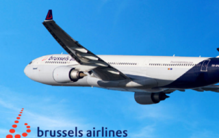 A Brussels Airlines aircraft flying against a blue sky with the Brussels Airline logo in the bottom left