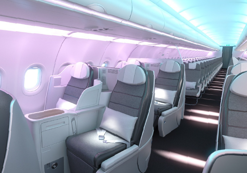 Cobalt Spectrum LED cabin lighting illuminating a commercial aircraft cabin.