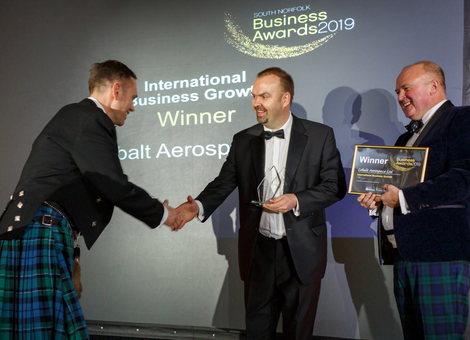 Founder and director Ben Brown accepts the award for 'International Business Growth' at the South Norfolk Business Awards 2019.